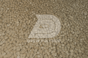 Repurposed PEEK polymer pellets with the Drew Polymer logo, supporting sustainable high-performance manufacturing